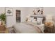Bedroom with a neutral color scheme, closet, and windows for natural light and a serene aesthetic at 11775 E Becker Ln, Scottsdale, AZ 85259