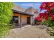 Exterior featuring a covered patio, gravel landscaping, and desert flora for low-maintenance appeal at 11775 E Becker Ln, Scottsdale, AZ 85259