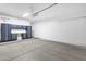 Spacious garage with ample room for parking and storage with modern gray cabinets at 11775 E Becker Ln, Scottsdale, AZ 85259