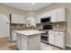 Bright kitchen with granite countertops, stainless steel appliances, and white cabinetry at 11775 E Becker Ln, Scottsdale, AZ 85259