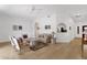 Spacious living room with light wood floors, arched entryways and comfortable seating at 11775 E Becker Ln, Scottsdale, AZ 85259