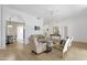 Bright living area with comfortable seating, arched entryways and views into the dining area at 11775 E Becker Ln, Scottsdale, AZ 85259