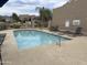 Community pool with sun loungers, inviting blue water and secure perimeter fencing at 11775 E Becker Ln, Scottsdale, AZ 85259