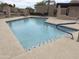Refreshing community pool with inviting cool blue water and modern concrete deck and fencing at 11775 E Becker Ln, Scottsdale, AZ 85259