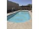 Relaxing community pool with lounge chairs and inviting, clear water for a refreshing swim at 11775 E Becker Ln, Scottsdale, AZ 85259