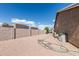 Spacious gravel backyard area, enclosed by a tall block wall for privacy, great for various outdoor uses at 1207 E Clearview Dr, Casa Grande, AZ 85122