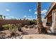 Charming backyard area featuring a fire pit, greenery, and a cozy outdoor space for relaxation at 1207 E Clearview Dr, Casa Grande, AZ 85122
