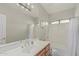 Bright bathroom with large mirror, vanity lighting, and shower/tub combo at 1207 E Clearview Dr, Casa Grande, AZ 85122