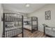 Bedroom features two bunk beds with dark metal frames and a modern, minimalist design at 1207 E Clearview Dr, Casa Grande, AZ 85122