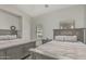 Bedroom features matching beds, a window, and a neutral color scheme creating a calming atmosphere at 1207 E Clearview Dr, Casa Grande, AZ 85122
