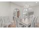 Open dining room with wood floors, chandelier, with views to office and front entrance at 1207 E Clearview Dr, Casa Grande, AZ 85122