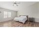 Bright main bedroom with hardwood floors, ceiling fan, and natural light at 1207 E Clearview Dr, Casa Grande, AZ 85122