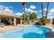 Backyard featuring a pool with a spa, palm trees and lounge chairs at 1207 E Clearview Dr, Casa Grande, AZ 85122