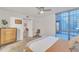 Bright bedroom with light wood dresser, concrete floor, ceiling fan and view to the courtyard at 1241 E Medlock Dr # 112, Phoenix, AZ 85014