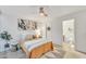 Bright bedroom with stylish decor, ceiling fan, and ensuite bathroom at 1241 E Medlock Dr # 112, Phoenix, AZ 85014