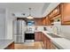 Well-equipped kitchen with stainless steel appliances and sleek white countertops at 1241 E Medlock Dr # 112, Phoenix, AZ 85014