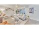 Spacious living room with modern furniture, neutral tones, and access to patio at 1241 E Medlock Dr # 112, Phoenix, AZ 85014