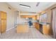 Charming kitchen with a center island, stainless appliances, and tile flooring at 12626 W Windsor Ave, Avondale, AZ 85392