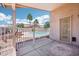 Covered patio offers views of the backyard with a fenced pool and palm trees at 12626 W Windsor Ave, Avondale, AZ 85392