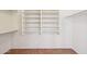 Bright walk-in closet with custom shelving and tile flooring at 12626 W Windsor Ave, Avondale, AZ 85392