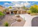 Beautiful home with desert landscaping, large driveway, and a convenient three-car garage at 12702 W Dove Wing Way, Peoria, AZ 85383