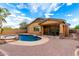 Outdoor living in this backyard with a pool, spa, paved patio, and covered porch at 12702 W Dove Wing Way, Peoria, AZ 85383