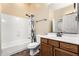 Bathroom features a shower with a curtain, a toilet, and a vanity with drawers at 12702 W Dove Wing Way, Peoria, AZ 85383