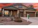 Charming home with desert landscaping, a covered porch, a three-car garage and for sale sign at 12702 W Dove Wing Way, Peoria, AZ 85383