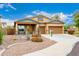 Beautiful single-Gathering home with a 3-car garage, covered porch, and desert landscaping at 12702 W Dove Wing Way, Peoria, AZ 85383