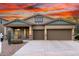 Beautiful single-story home featuring a well-manicured front yard and a three-car garage at 12702 W Dove Wing Way, Peoria, AZ 85383