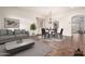 Staged living and dining area with stylish furniture and decor creates a welcoming atmosphere at 12702 W Dove Wing Way, Peoria, AZ 85383