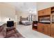 Relaxing main bedroom with a seating area, ceiling fan, and ample closet space, offering comfort and functionality at 12702 W Dove Wing Way, Peoria, AZ 85383