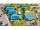 Bird's eye view of community pickleball and tennis courts surrounded by mature trees and landscaping at 12702 W Dove Wing Way, Peoria, AZ 85383