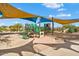 Vibrant playground featuring various play structures and shaded seating, perfect for active outdoor adventures at 12702 W Dove Wing Way, Peoria, AZ 85383