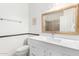 Bathroom featuring a toilet, sink and glass shower with neutral decor at 1432 W Hopi Dr, Chandler, AZ 85224