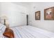 Bedroom featuring a bed and sliding closet with neutral decor at 1432 W Hopi Dr, Chandler, AZ 85224