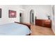 Well-lit bedroom with neutral colors, wood floors, and ample closet space at 1432 W Hopi Dr, Chandler, AZ 85224