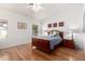 Comfortable bedroom with hardwood floors and natural light from large windows at 1432 W Hopi Dr, Chandler, AZ 85224