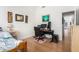 This bedroom boasts laminate wood flooring and a desk area at 1432 W Hopi Dr, Chandler, AZ 85224