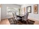 Bright dining area features natural light from a large window and modern decor at 1432 W Hopi Dr, Chandler, AZ 85224