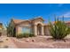 Charming single-story home with desert landscaping and an arched entryway at 1432 W Hopi Dr, Chandler, AZ 85224
