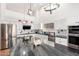Gourmet kitchen boasts stainless steel appliances, a large island, and modern finishes at 1432 W Hopi Dr, Chandler, AZ 85224