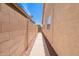 View of a narrow side yard featuring a walkway and a block wall creating a private space at 1432 W Hopi Dr, Chandler, AZ 85224