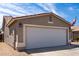 Close up of a two-car garage on an exterior elevation at 15047 W Kings Dr, Surprise, AZ 85374