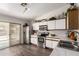 Kitchen featuring stainless steel appliances, white cabinets with wood trim, and marble countertops at 15047 W Kings Dr, Surprise, AZ 85374