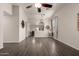 Open-concept living room boasts modern flooring, neutral colors, and seamless flow to dining at 15047 W Kings Dr, Surprise, AZ 85374