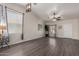 Bright living room with sleek flooring, large window, and neutral paint at 15047 W Kings Dr, Surprise, AZ 85374