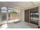 Bright sunroom with tiled floors and sliding glass doors leading to the outdoors at 15047 W Kings Dr, Surprise, AZ 85374
