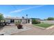 An expansive backyard features multiple patio areas and a small section of artificial turf at 15049 N 25Th Pl, Phoenix, AZ 85032