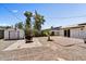 Large backyard with a storage shed, rock landscaping and artificial turf at 15049 N 25Th Pl, Phoenix, AZ 85032